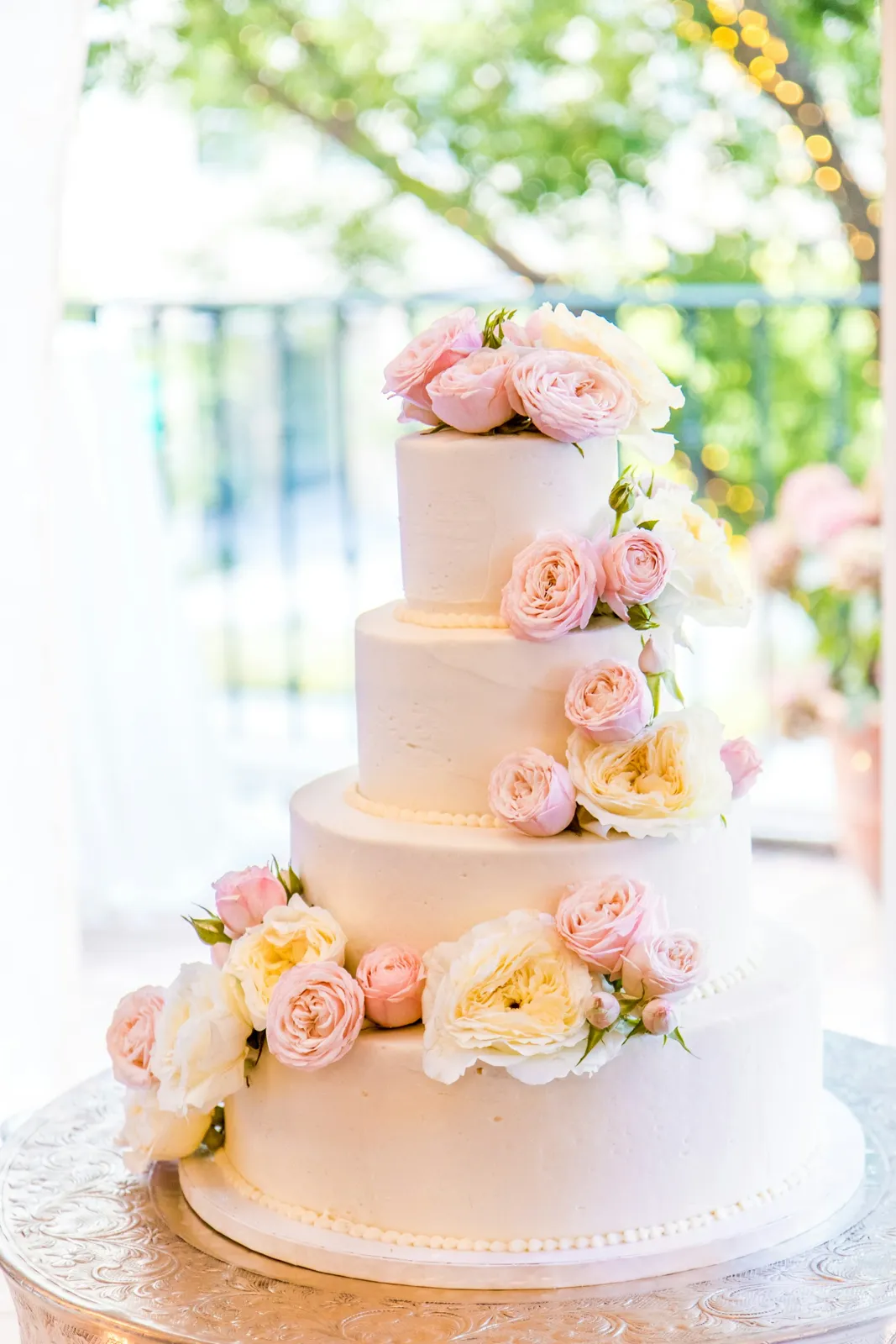 Tiered wedding cake with roses